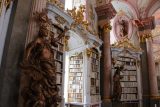 Admont_081_07062018 - Looking towards some of the bronze statues flanking some window and books near the center of the Stift Admont Library