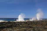 Alofaaga_Blowholes_059_11142019 - Looking in the distance towards another person standing near a trio of erupting Alofaaga Blowholes in Savai'i
