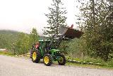 Amotan_004_07152019 - Someone having fun riding a tractor at the Jenstad Farm