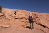 Arches_NP_175_04192017 - Tahia and Julie making their way up the slickrock slope on the Delicate Arch Trail