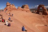 Arches_NP_279_04192017 - Context of people checking out Delicate Arch from the opposite side of the large and steep bowl