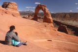 Arches_NP_294_04192017 - Julie and Tahia checking out the Delicate Arch backed by the La Sal Mountains