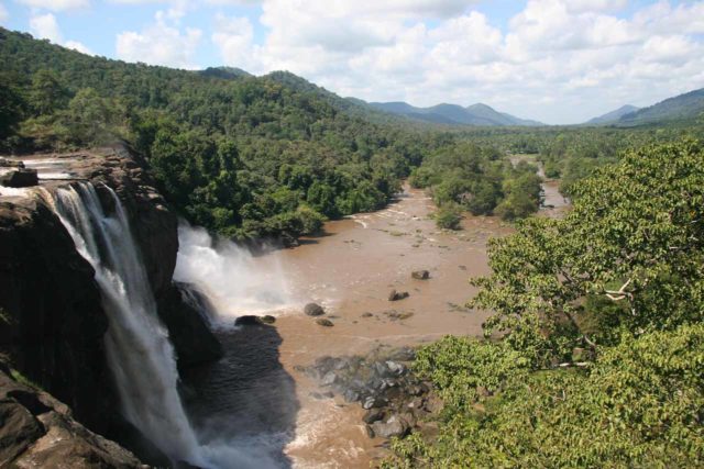 Composing Athirappilly Falls to draw the viewer's gaze along the river towards the valley in the distance thereby utilizing as much of the frame as possible