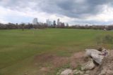 Austin_401_03112016 - Looking across the wide lawn of Zilker Park towards the Austin Skyline in the distance with some dark clouds looming overhead