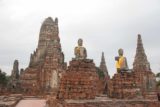 Ayutthaya_032_12252008 - Pair of intact Buddha statues sitting before the main ruins
