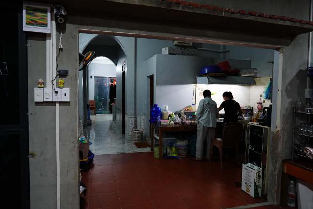 Mom wanting to help out the hostess of this homestay in Ba Be Lake in Vietnam as she was preparing dinner for the guests