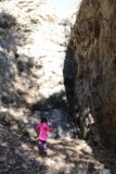 Bailey_Canyon_068_02062016 - Tahia examining the dry Bailey Canyon Falls closely