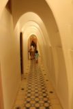 Barcelona_151_06202015 - Julie and Tahia walking through an egg-shaped archway inside Casa Batllo
