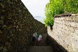 Bias_Tugel_008_06182022 - The ladies descending between walls towards the Pantai Bias Tugel