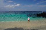 Bias_Tugel_020_06182022 - Tahia going knee deep in the colorful waters off the hidden Bias Tugel Beach