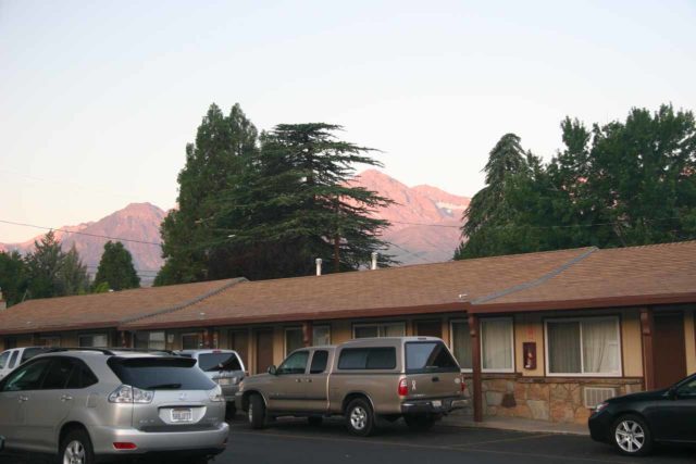 Cars parked in front of rooms for easy access is a signature trait of motels