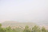 Bin_el_Ouidane_to_Khenifra_004_05182015 - Looking through the hazy skies towards intensely cultivated agricultural fields