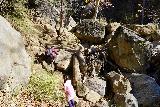 Black_Star_Canyon_Falls_184_01042020 - Julie and Tahia ascending more boulder and fallen log obstacles deep upstream on Black Star Creek