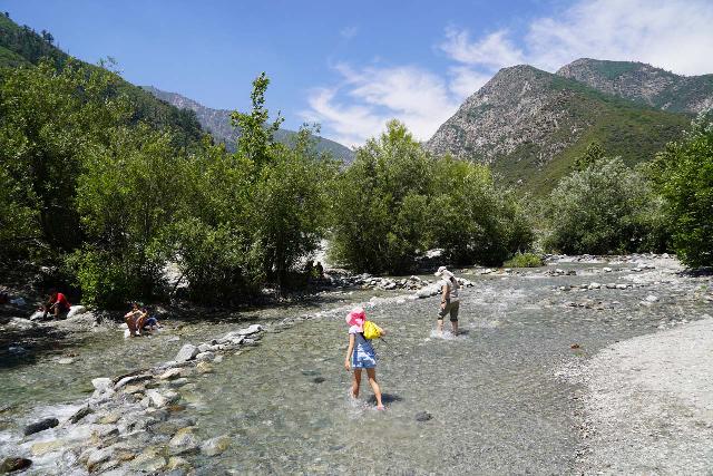 My daughter and wife both wading through a creek crossing in Crocs. My wife had changed out of her day hiking shoes so she could do this crossing without ruining them