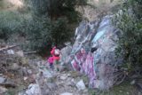 Bonita_Falls_15_053_12312015 - Julie and Tahia hiking past even more graffiti-laced rocks on the last part of the trail to Bonita Falls