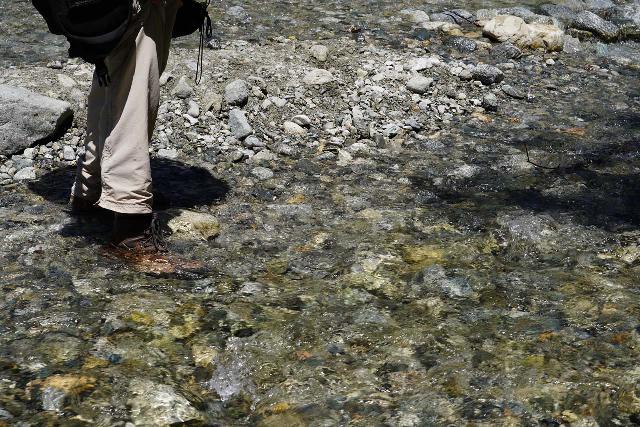 My waterproof hiking boots stepping in ankle-deep water and still keeping my feet dry