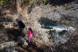 Box_Canyon_058_04022021 - Julie and Tahia hiking by the brink of the Box Canyon Waterfall