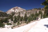 Bumpass_Hell_294_07122016 - Negotiating more snow patches in view of Lassen Peak on the return hike