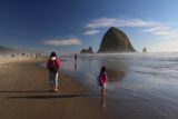 Cannon_Beach_17_028_08172017 - Julie and Tahia enjoying themselves at the edge of the ocean at the attractive Cannon Beach and the Haystack Rocks