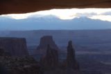 Canyonlands_17_022_04212017 - Looking through Mesa Arch with Washer Woman Arch and Monster Butte fronting the silhouettes of the snowy La Sal Mountains
