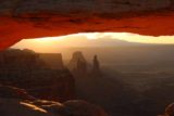 Canyonlands_17_134_04212017 - Looking through Mesa Arch after sunrise towards the silhouettes of Washer Woman Arch and Monster Butte