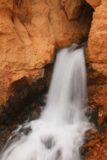 Cascade_Falls_Cedar_074_05252017 - Looking at the very top of Cascade Falls gushing out of a hike in the red cliffs