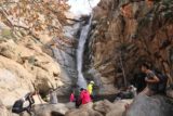 Cedar_Creek_Falls_125_01072017 - Context of Tahia and Julie having a picnic lunch surrounded by other people sitting across the plunge pool of Cedar Creek Falls in January 2017