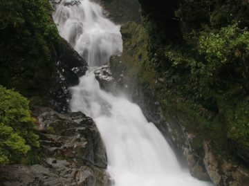 Christie Falls was a roadside waterfall right besides a narrow single-lane bridge on the Milford Sound Highway.  Because it was next to a sign that said 