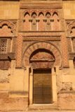 Cordoba_259_05312015 - An Arabic arch framing a closed door at the perimeter of la Mezquita
