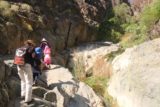 Death_Valley_17_069_04082017 - The family negotiating another one of the tricky parts of the scramble upstream to Darwin Falls as the closed in canyon and the presence of Darwin Creek posed some obstacles along the way