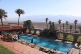 Death_Valley_17_394_04082017 - Looking over a swimming pool and towards the barren salt flat expanse of Death Valley