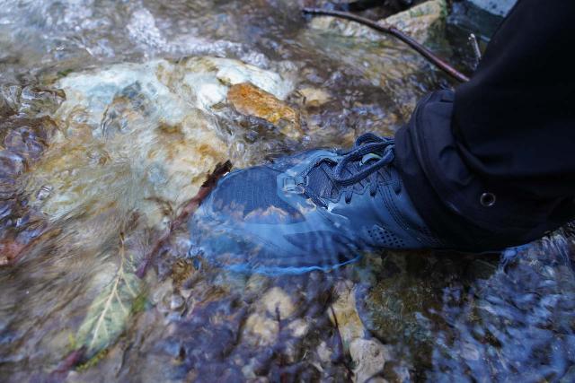 My daughter and wife both wading through a creek crossing in Crocs. My wife had changed out of her day hiking shoes so she could do this crossing without ruining them