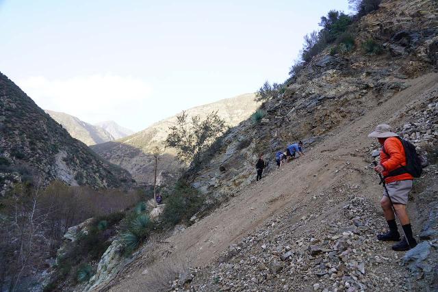 You often can't predict what kind of obstacles you will face, which is why legitimate hiking boots and/or shoes with good grip will immensely help. The trio of hikers in the distance here really struggled and eventually had to turn back