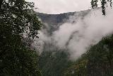 Drivandefossen_043_07212019 - Looking in the distance across the Mørkrisdal Valley towards a tall but very thin cascade behind the low clouds