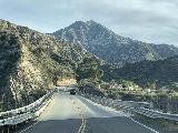 Drive_to_Fox_Canyon_TH_011_iPhone_01282022 - Continuing over this bridge across the Big Tujunga River with Josephine Peak in the distance