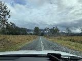 Drive_to_Purling_Brook_011_iPhone_07062022 - Driving back through an open part of the Gold Coast Hinterland under some menacing looking storm clouds en route to Purling Brook Falls