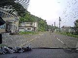Drive_to_Seseki_071_MingSung_07182023 - Looking ahead at another deer crossing the road on the way between Rausu to the Seseki Onsen