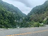 Drive_to_Ubagataki_063_iPhone_07052023 - Looking back at a bridge with Mom and Dad's rental car coming up behind us as we paused along the Hakusan-Shirakawago White Road near Ubagataki Falls