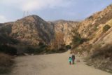 Eaton_Canyon_Falls_019_12102016 - Julie and Tahia approaching the mouth of Eaton Canyon in the late afternoon