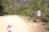 Eaton_Canyon_Falls_14_025_04062014 - Tahia pointing out a sign showing poison oak and rattlesnakes