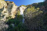 Escondido_Falls_066_03182023 - Broad look at the partially-lit upper drop of Escondido Falls in high volume