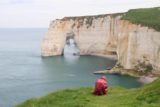 Etretat_385_20120507 - Context of Julie checking out Manneporte from the spot where we also noticed the Etretat Waterfall