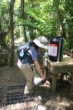 Fairy_Falls_004_01092010 - Julie dutifully spraying to help control kauri dieback disease on this trail too