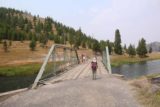Fairy_Falls_Yellowstone_008_08112017 - Julie crossing the bridge over the Firehole River at the Fairy Falls Trailhead during our August 2017 visit