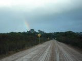 Fernhook_Falls_007_jx_06192006 - The unsealed road to Fernhook Falls with rainbow