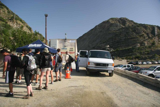 Fish_Canyon_Falls_130_03272010 - A long line of people waiting to board the Vulcan Materials shuttle through the quarry operation to get to the trailhead for Fish Canyon Falls