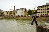 Florence_764_11222023 - Noticing a statue of someone about to walk over the edge and into the Arno River as seen from the Ponte alle Grazie