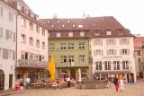 Freiburg_088_06212018 - Looking towards some corner of the Munsterplatz with a fountain and some pastel buildings in Freiburg im Breisgau