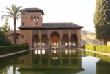 Granada_1435_05282015 - Looking back at the Palacio del Partal reflected in a pond