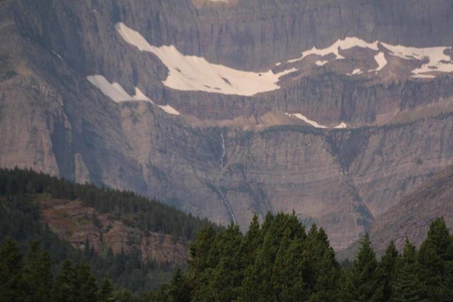 Grinnell_Glacier_004_08072017 - Looking way in the distance towards some random waterfall from across Swiftcurrent Lake at the Many Glacier Hotel